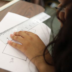 Zoomed in shot of a student using a Braille ruler.