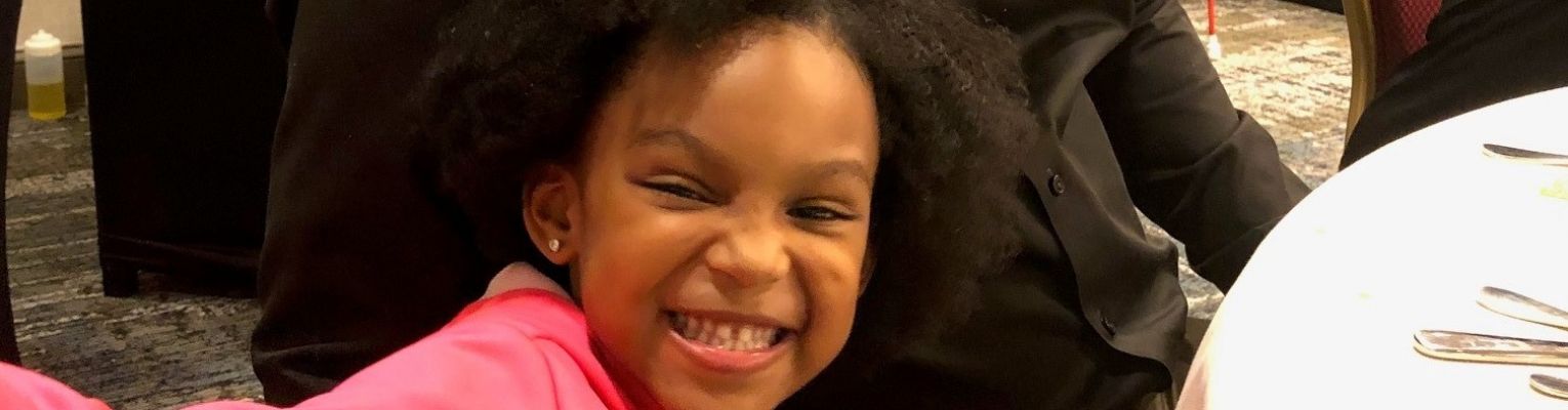 Shawn Callaway's daughter with a big smile.