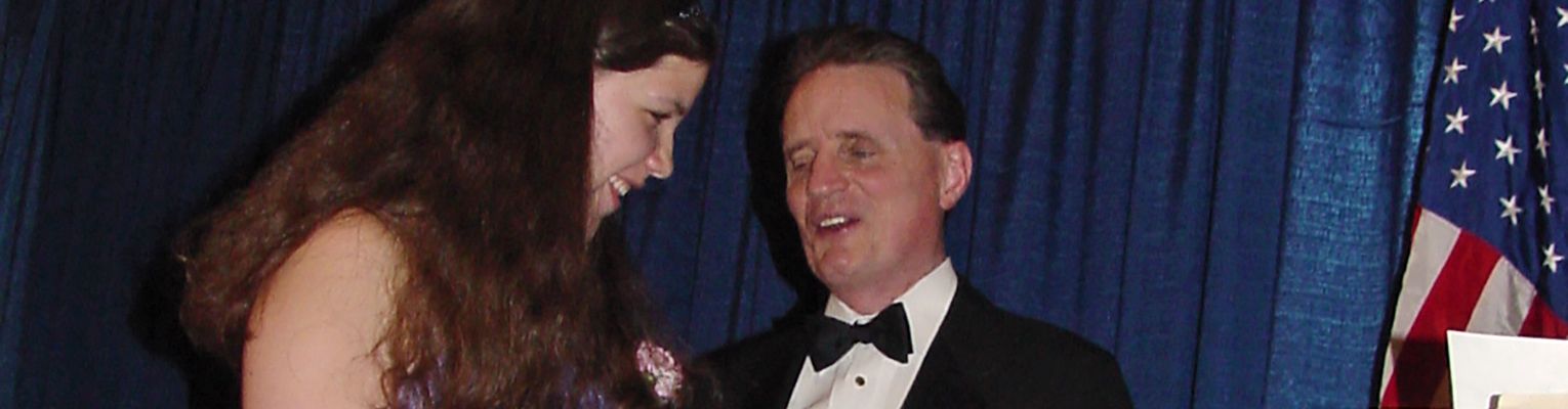 Cayte Mendez smiles with Marc Maurer as she receives her scholarship in 2001.