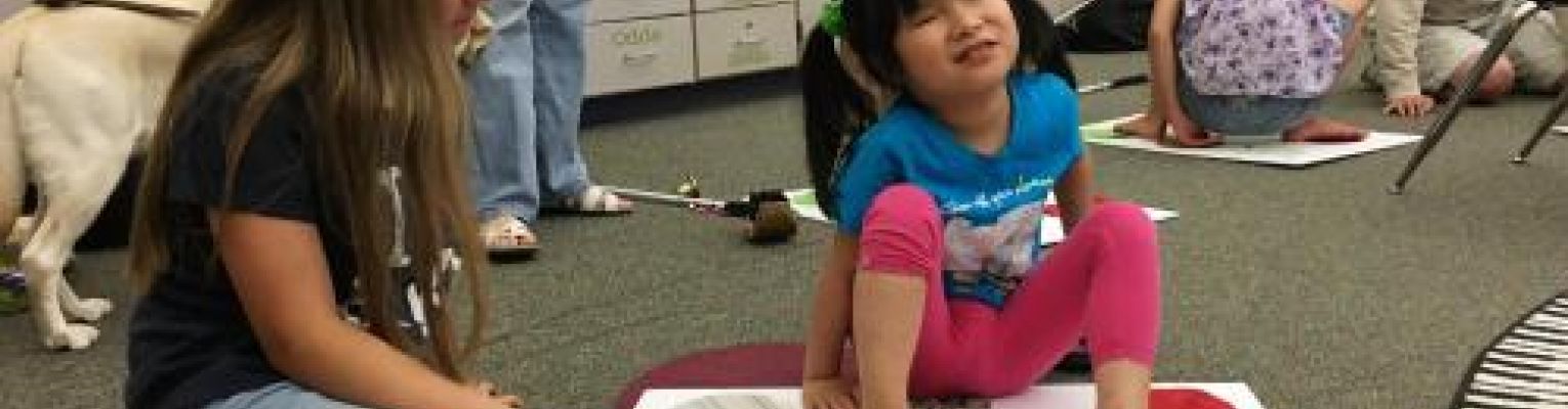 An NFB of Michigan BELL Academy student learns to make a j on a Braille Twister board.
