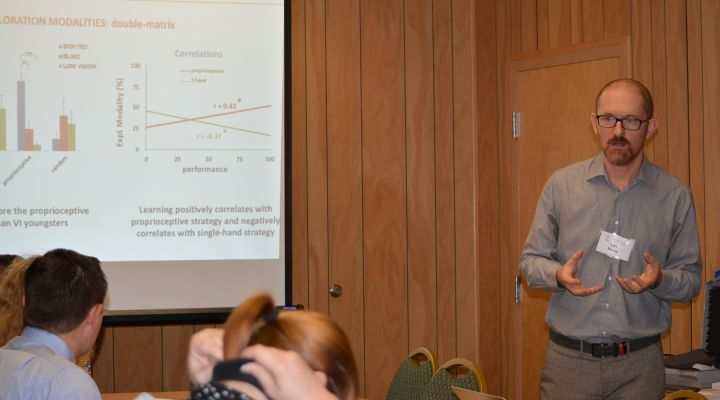A man addresses a session during the Tactile Graphics Symposium.